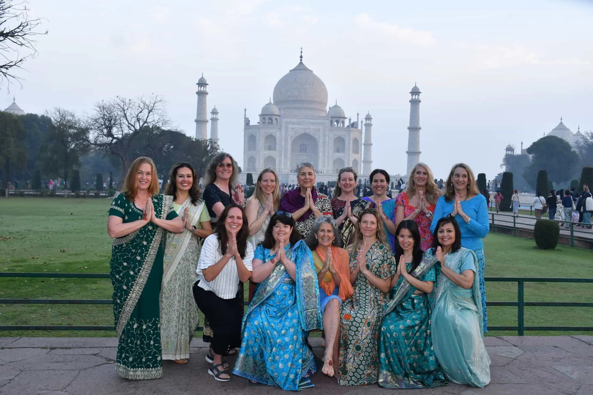 female tourists of janu private tours posing infront of taj mahal